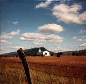Distant church in field